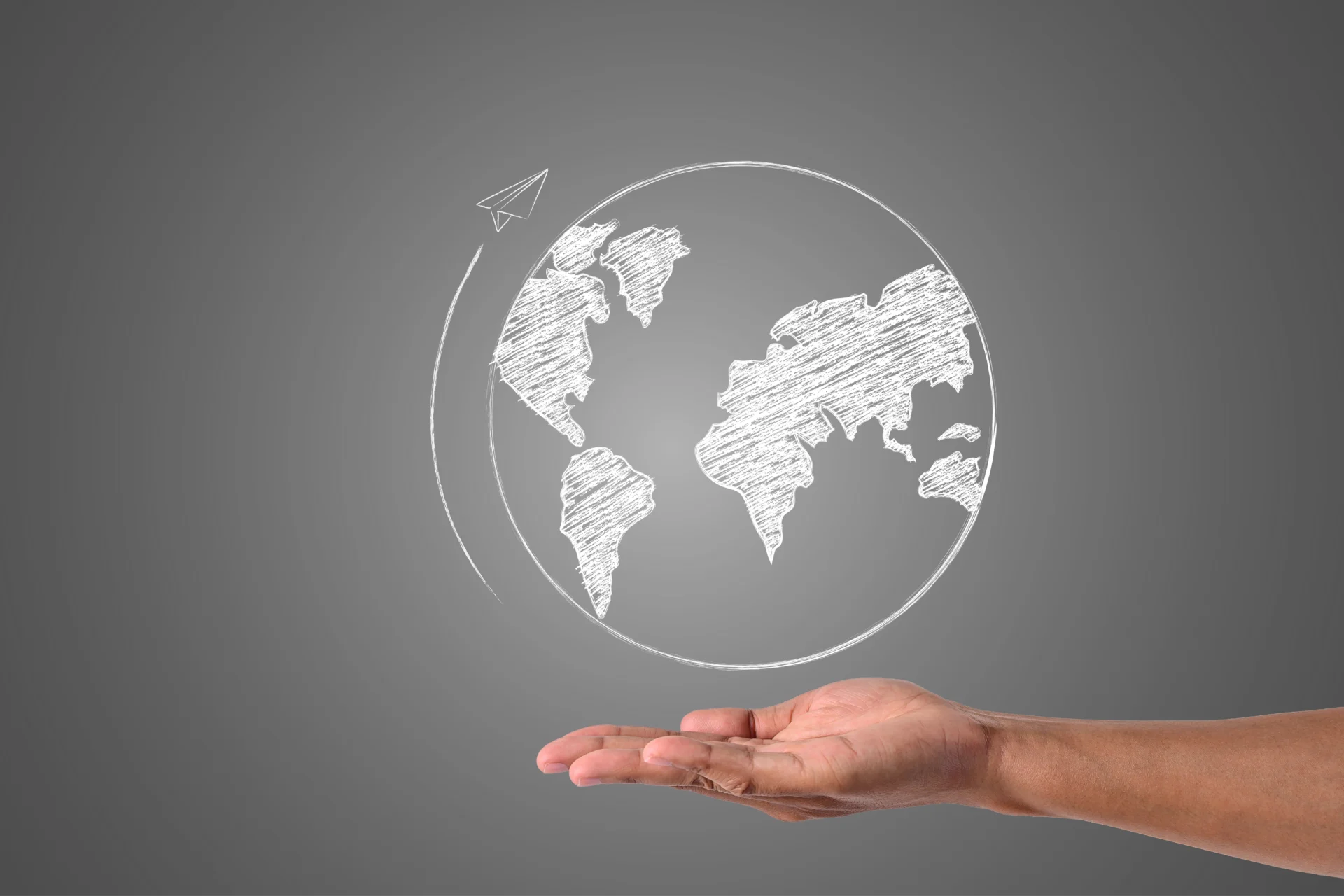 A palm facing up with a circular picture of the world above. It describes that someone should update or look at writing a will when they are planning to move abroad.